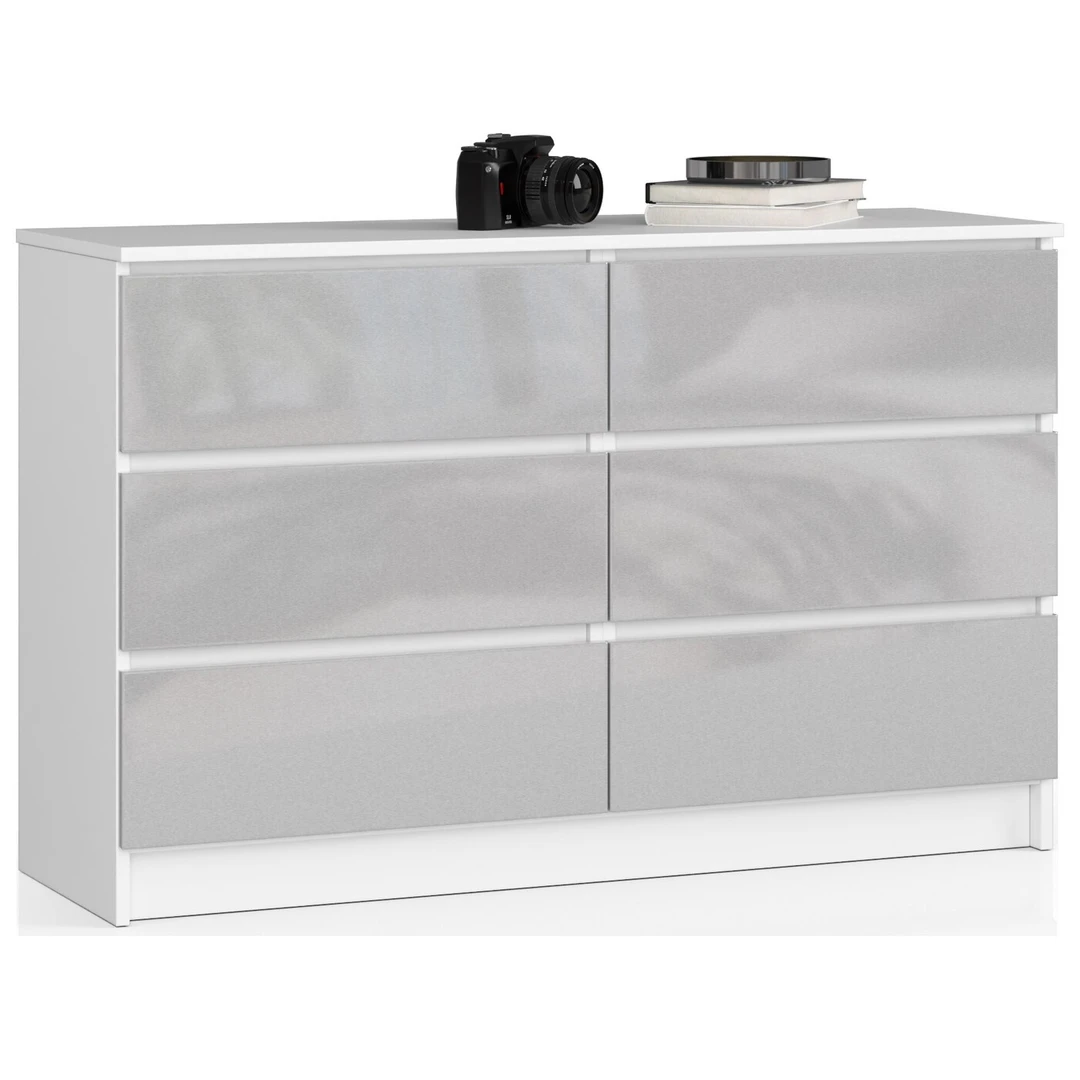 Balta laminuota komoda su blizgiu metaliniu dekoru