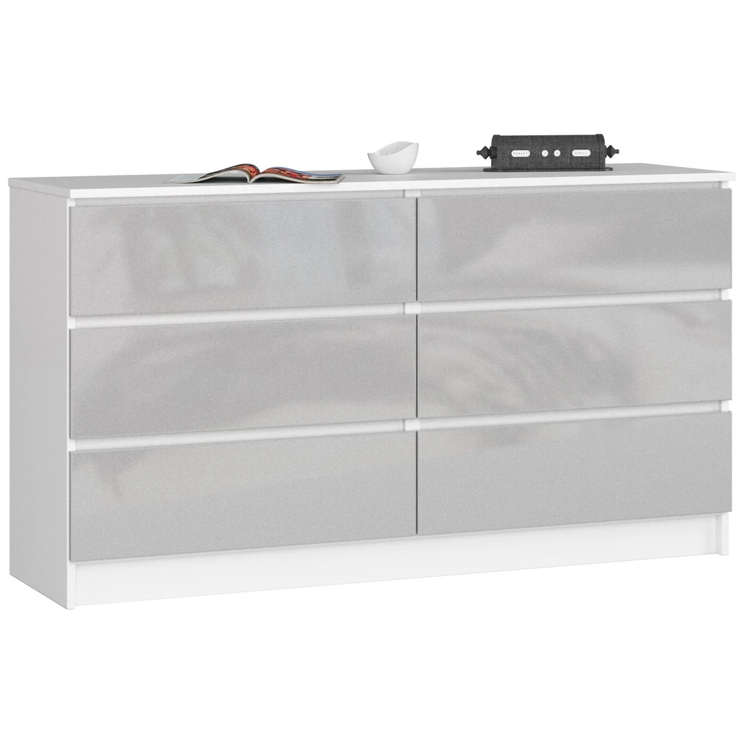 Balta laminuota komoda su blizgiu metaliniu dekoru