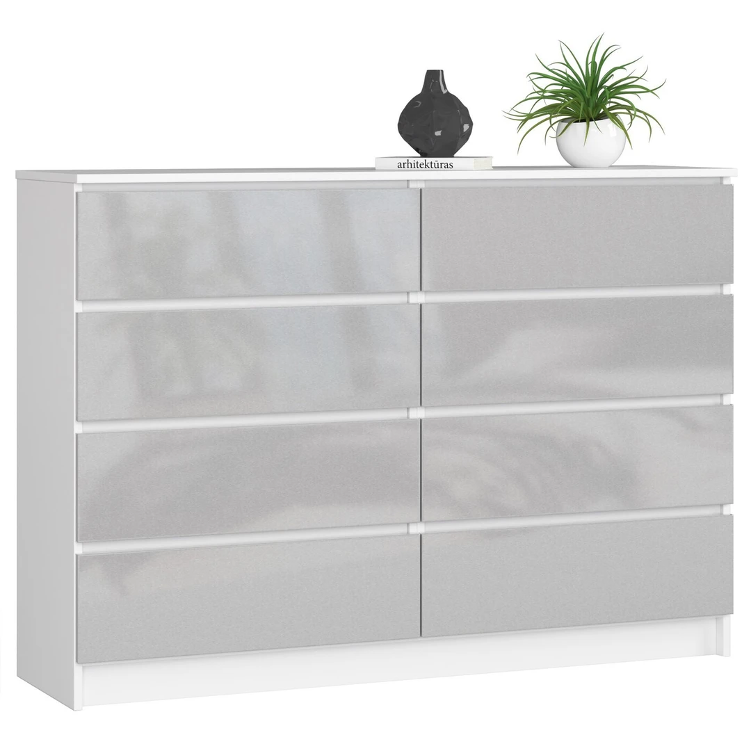 Balta laminuota komoda su blizgiu metaliniu dekoru