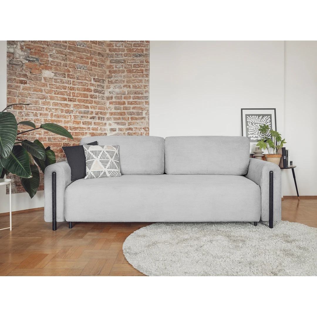 Minkšta mėlyna sofa su atlošais – komfortas ir stilius