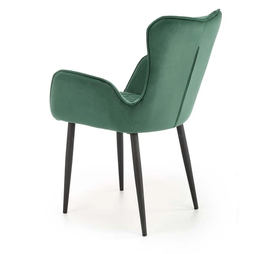 Tamsiai žalia sofė su aksominiu audiniu ir milteliniu plienu – puikus interjero akcentas